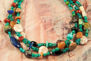Beautiful 3 strand Necklace featuring Genuine Kingman Turquoise, Blue Lapis, Apple Coral, Picture Jasper and Penshell Heishi.  Sterling Silver Extender, Cones and Clasp. Created by Santo Domingo Artist Carol Pacheco. The Santo Domingo Pueblo is in New Mexico, near Santa Fe. 
